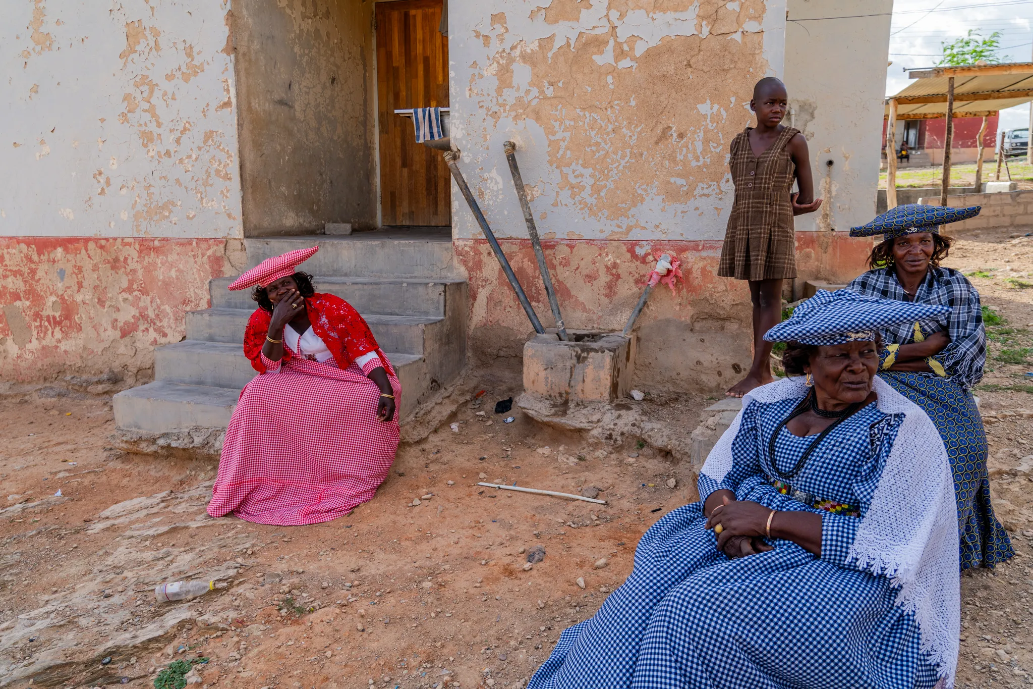 Herrera women outside one of their homes, Namibia
