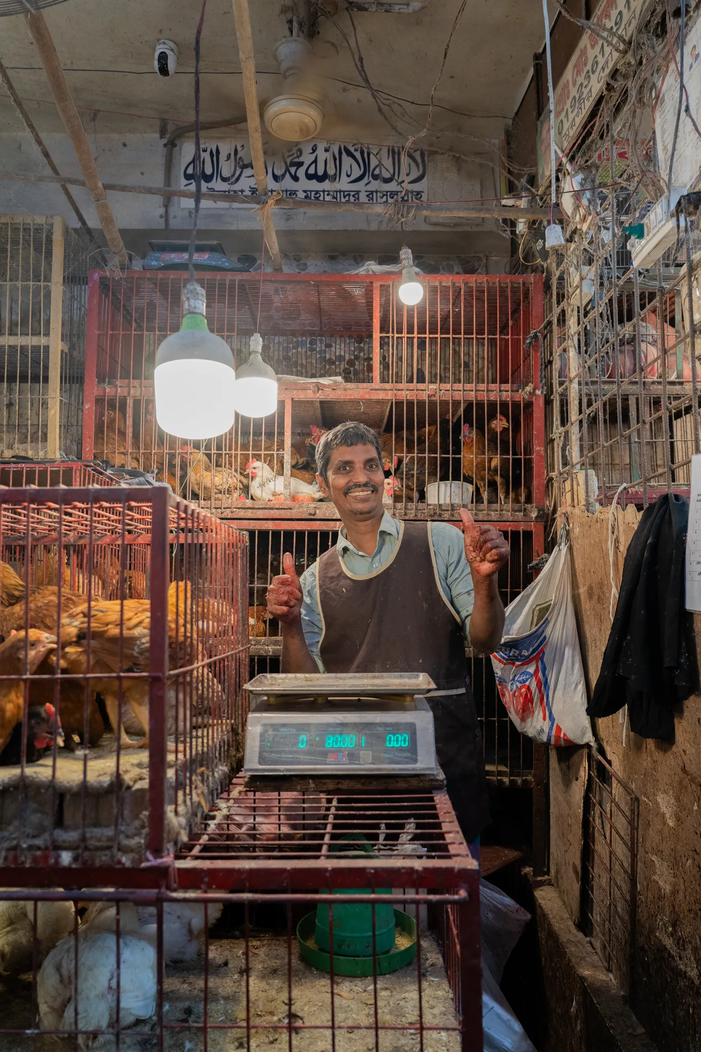 Thumbs up from a chicken market vendor, Bangladesh