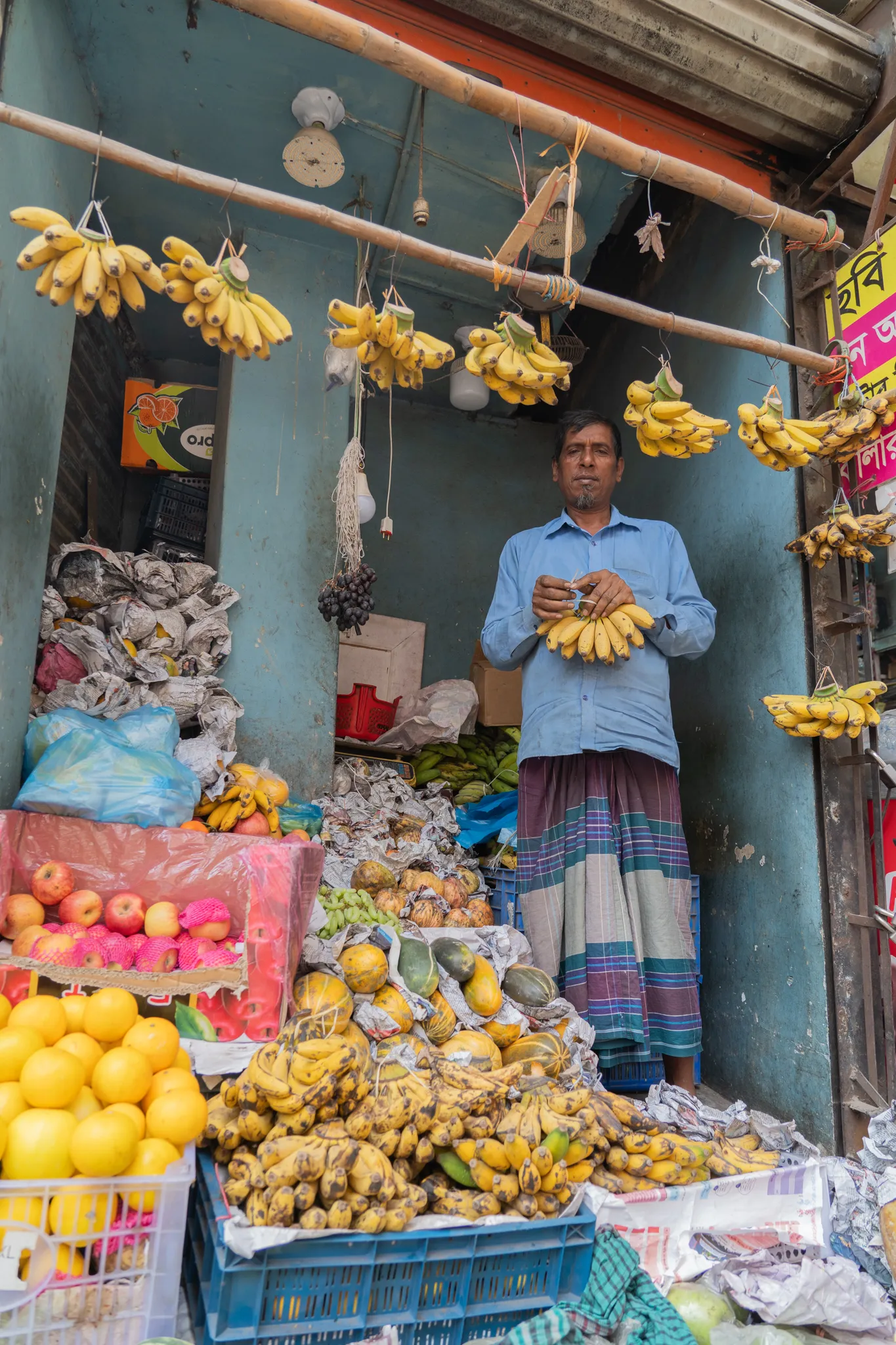 Fruit vendor with bananas, Bangladesh