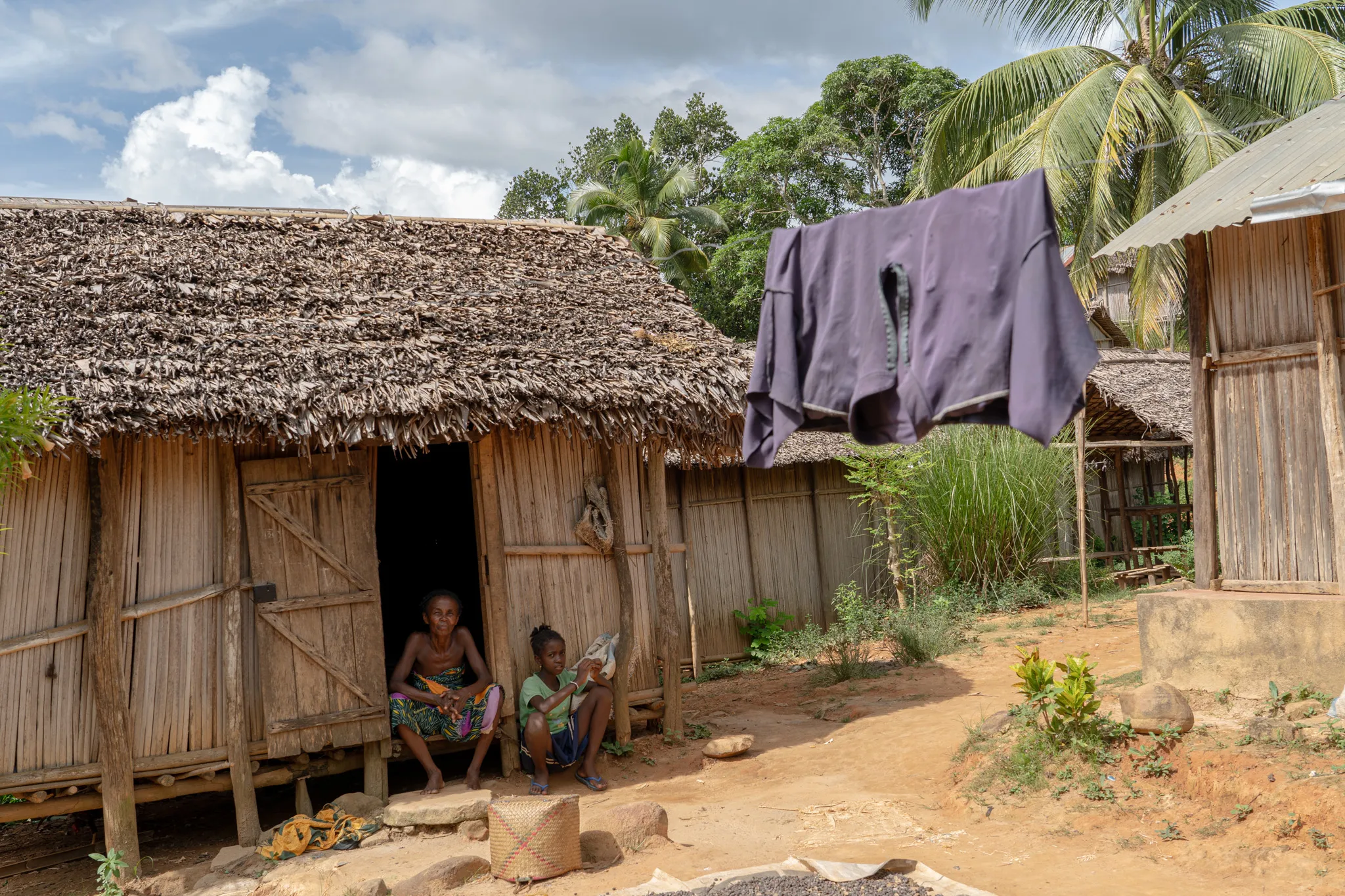 Laundry drying outside a thatched home in remote northern, Madagascar