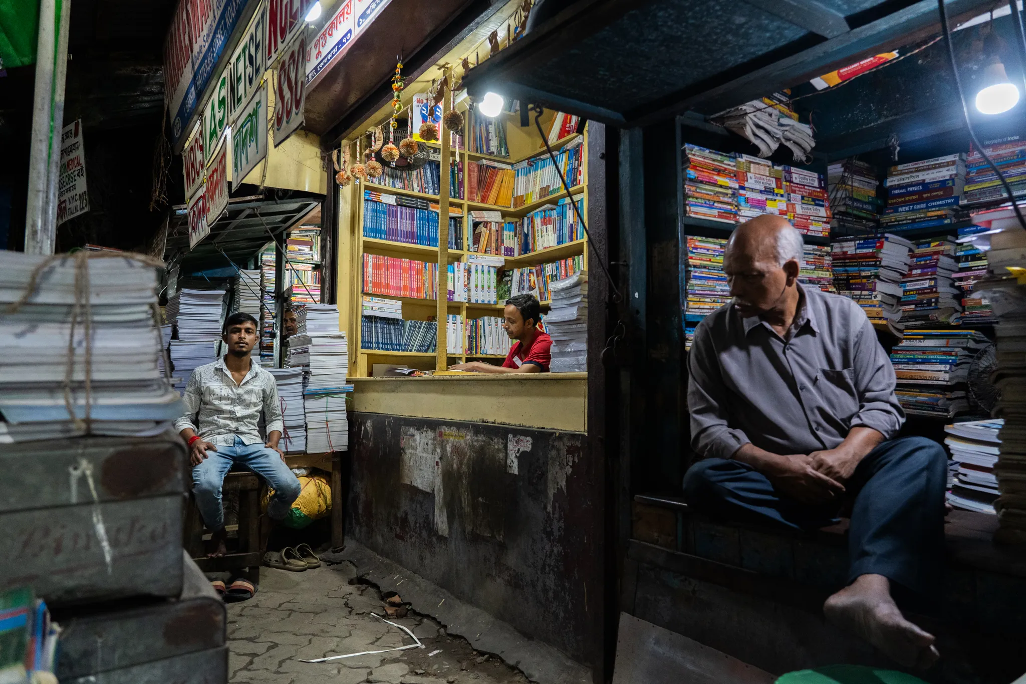 Booksellers at dusk, India