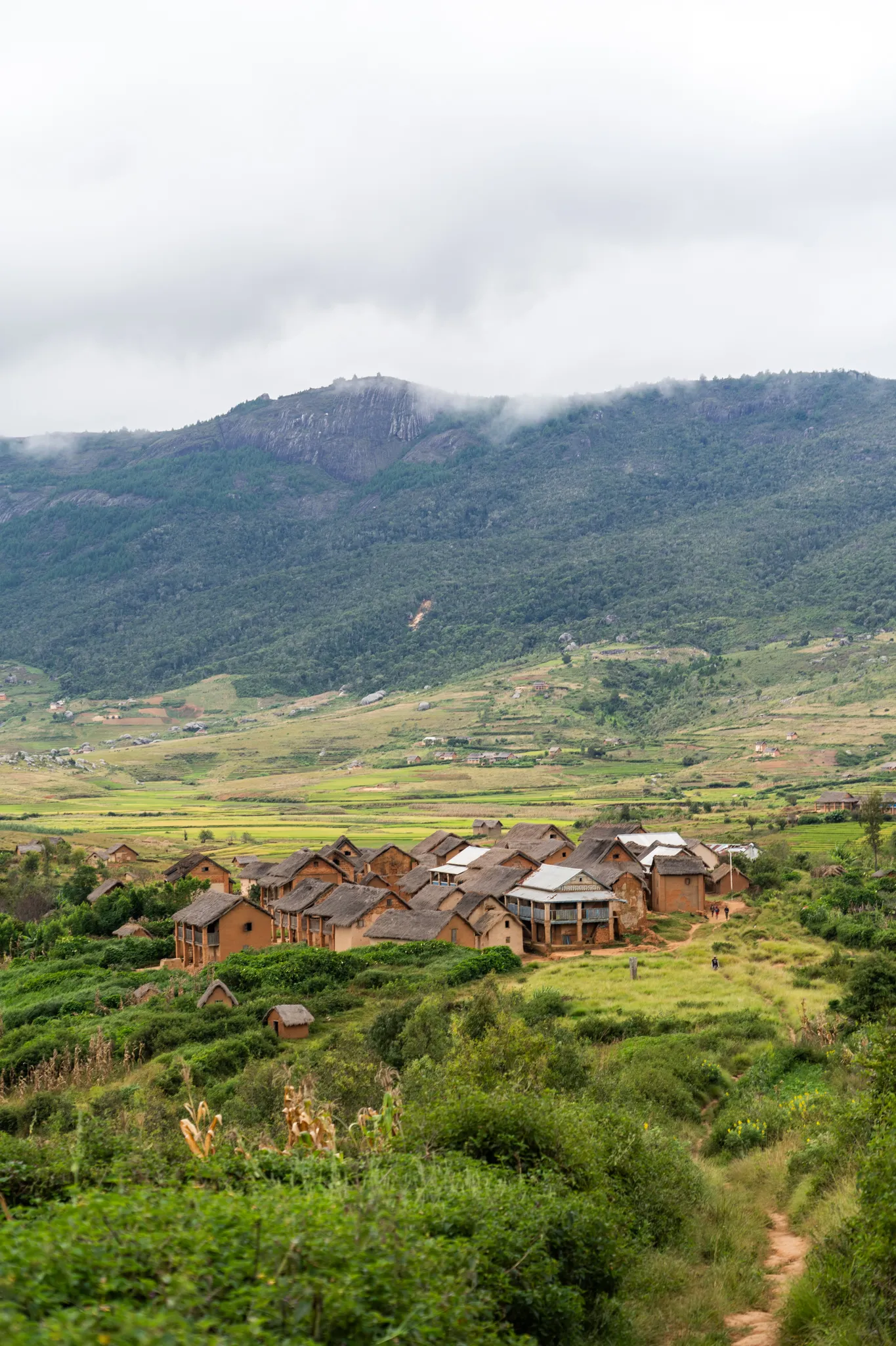 Village below a misty mountain in Andringitra National Park, Madagascar