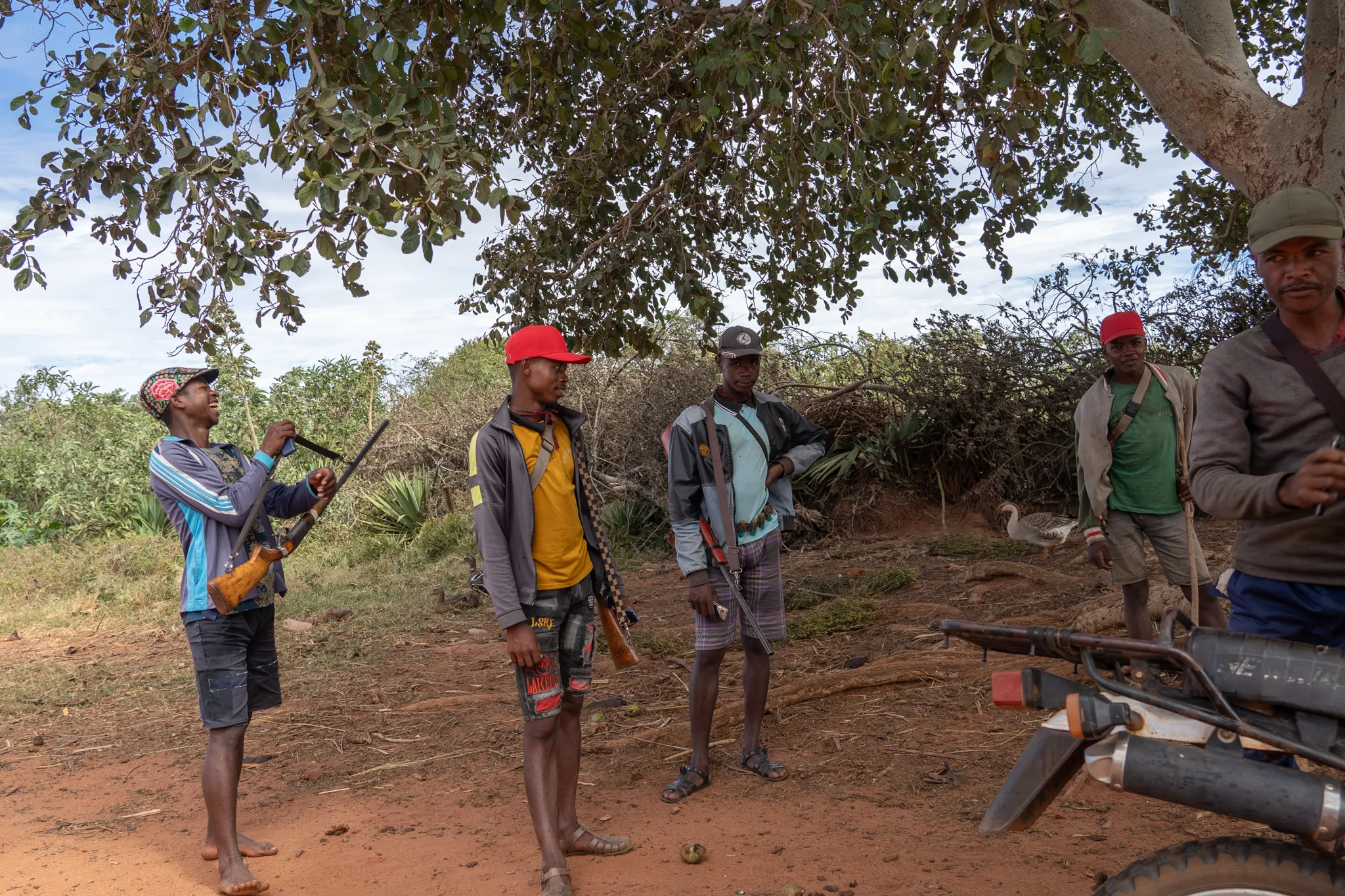 Bara men gathered in the shade, Madagascar