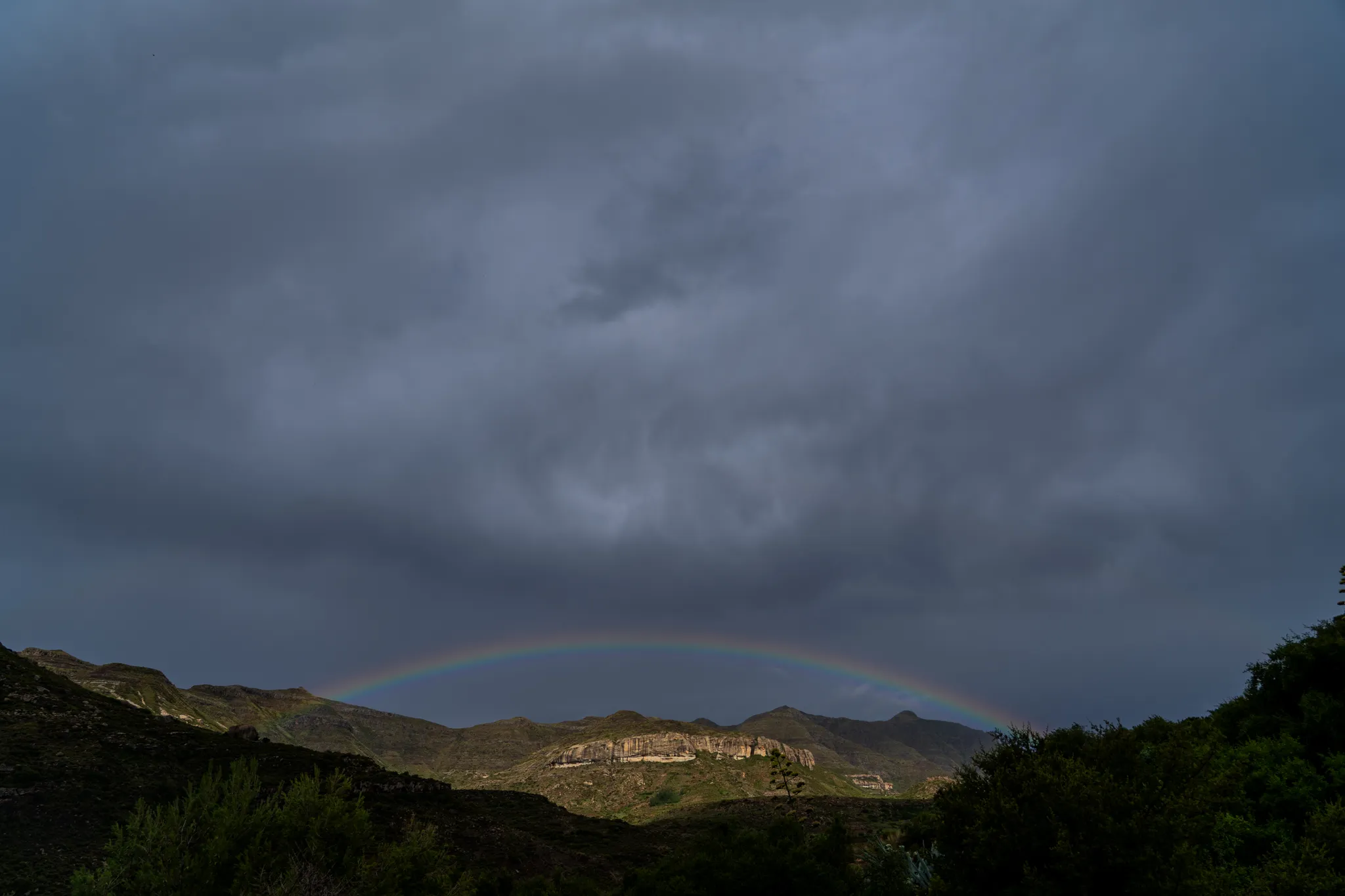 Rainbow over the mountains after rain, Lesotho