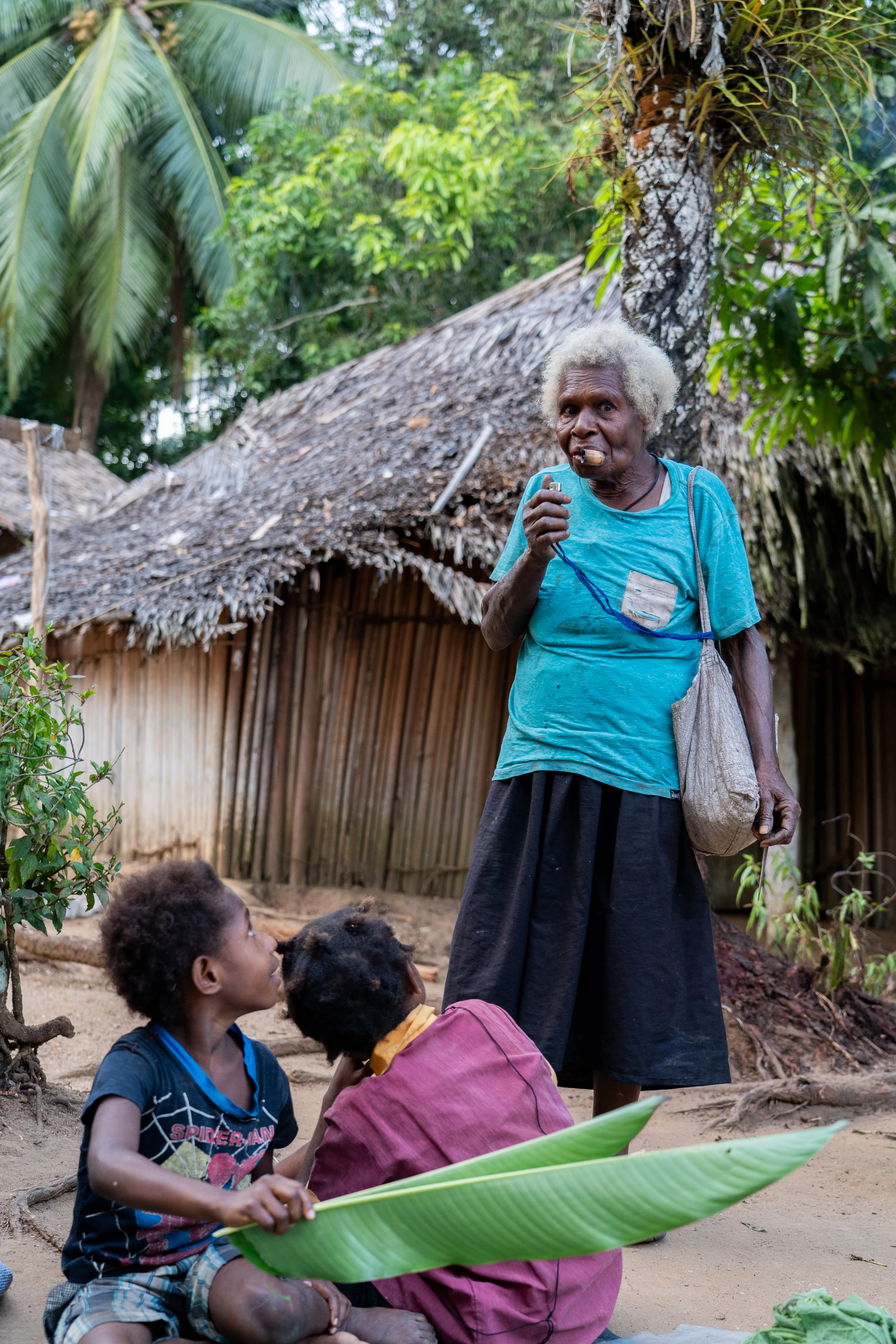 Elderly woman smoking a pipe, Papua New Guinea