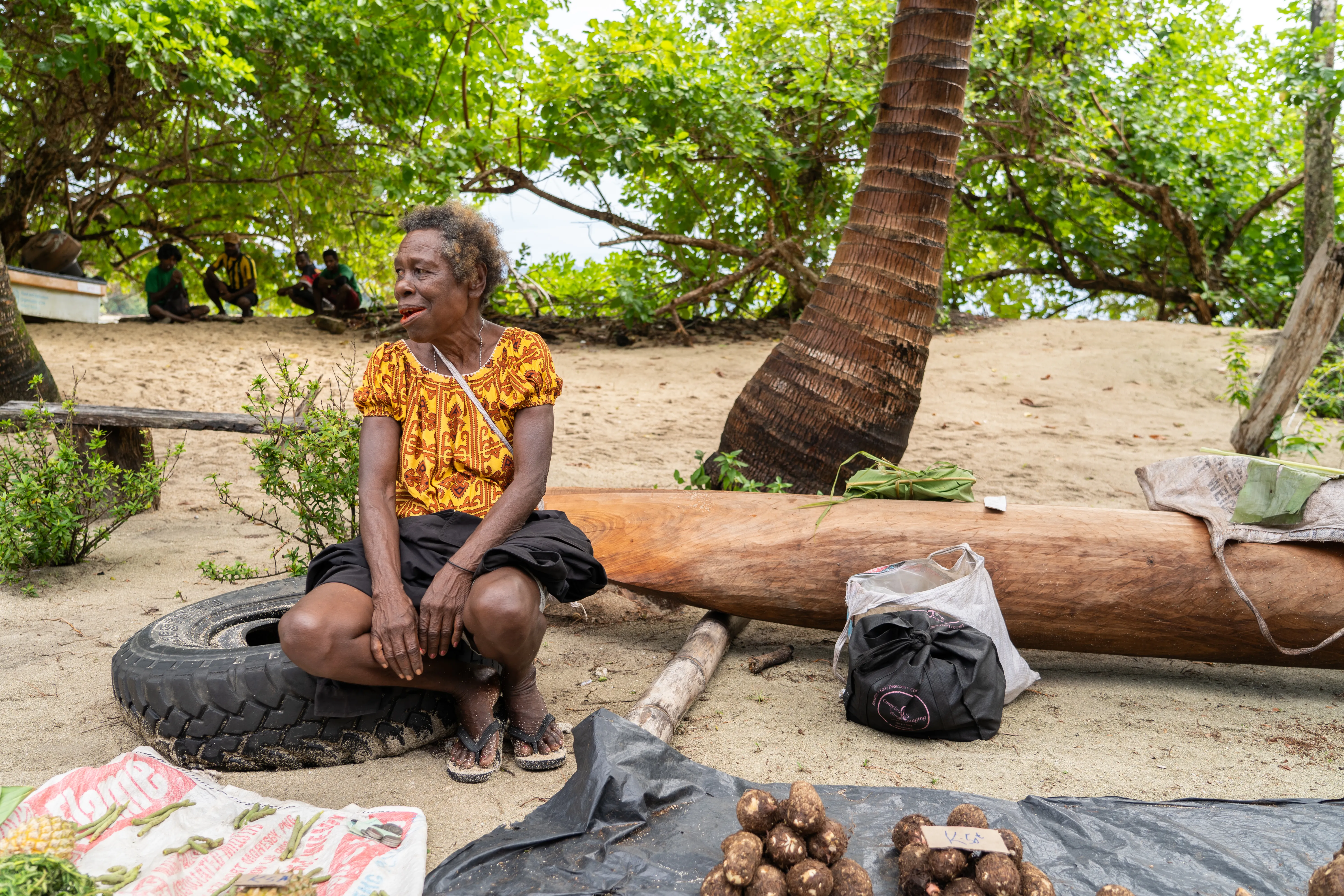 Woman selling on the islands off of the mainland, Papua New Guinea
