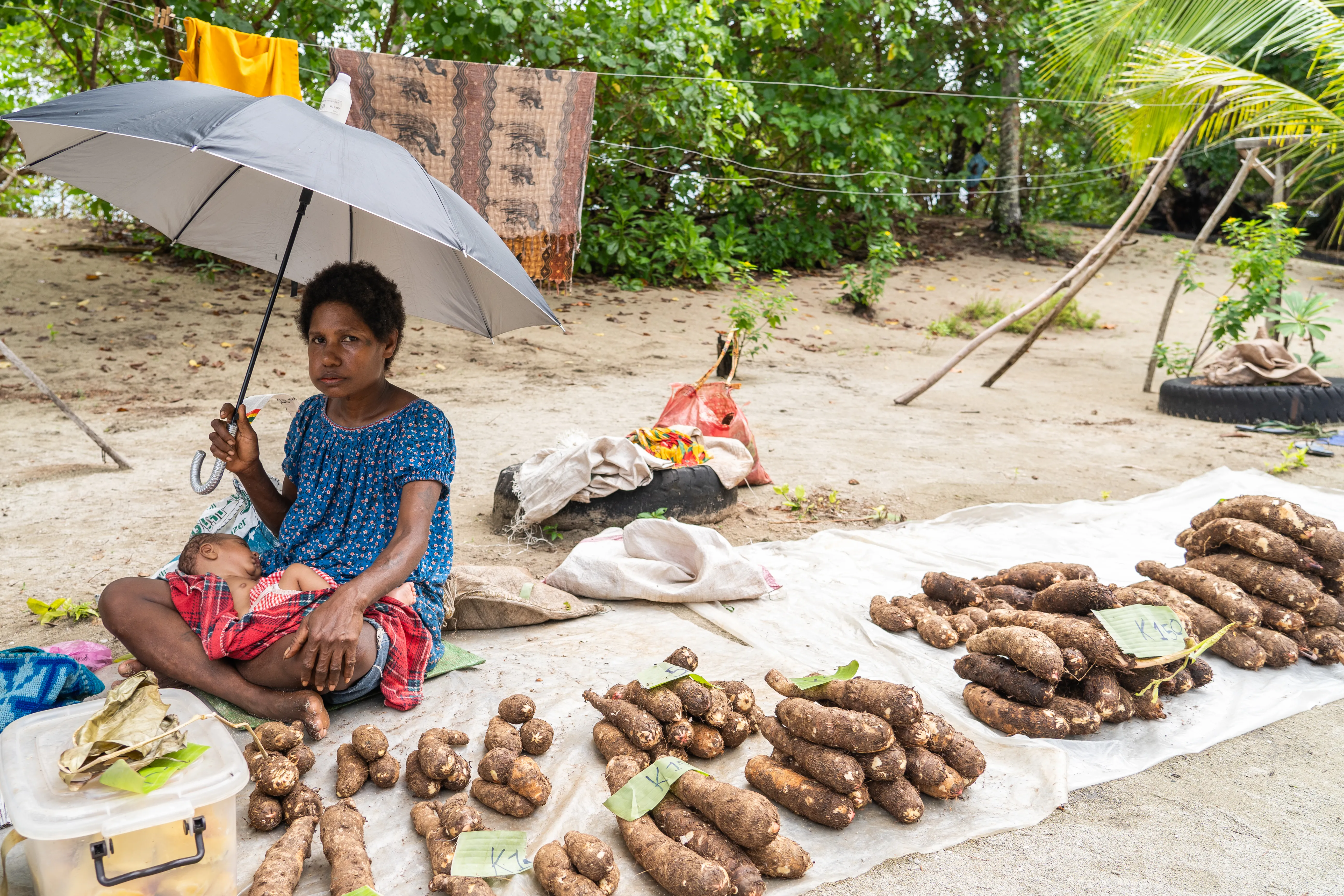 Woman selling produce on the islands, Papua New Guinea