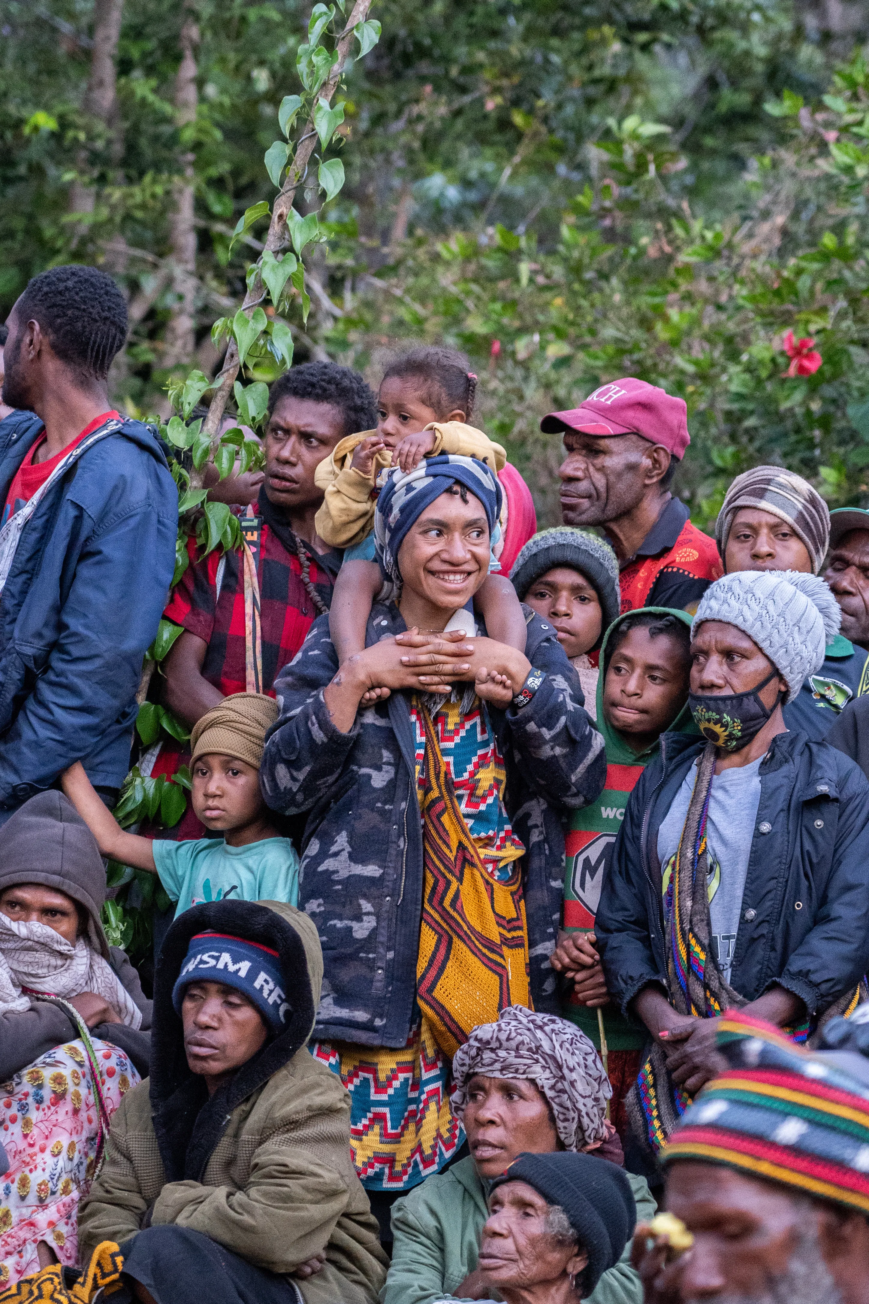Crowd gathers at a 'mumu', Papua New Guinea