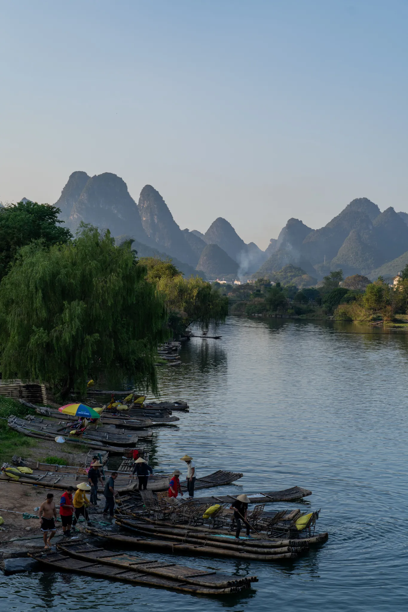 Bamboo rafts moored below Yangshuo's karst peaks, China