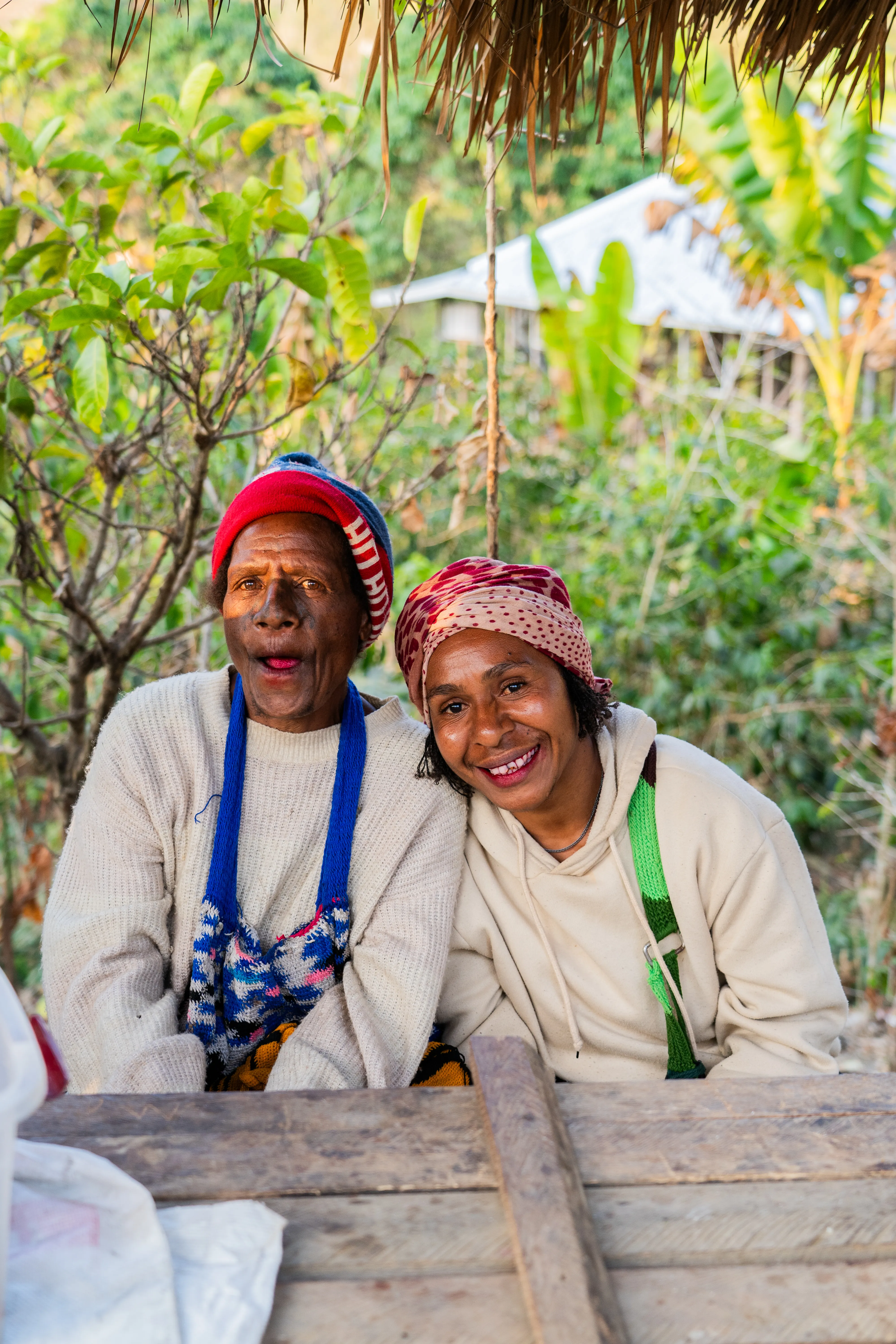 Mouths full of beetlenut, women at their stall selling, Papua New Guinea