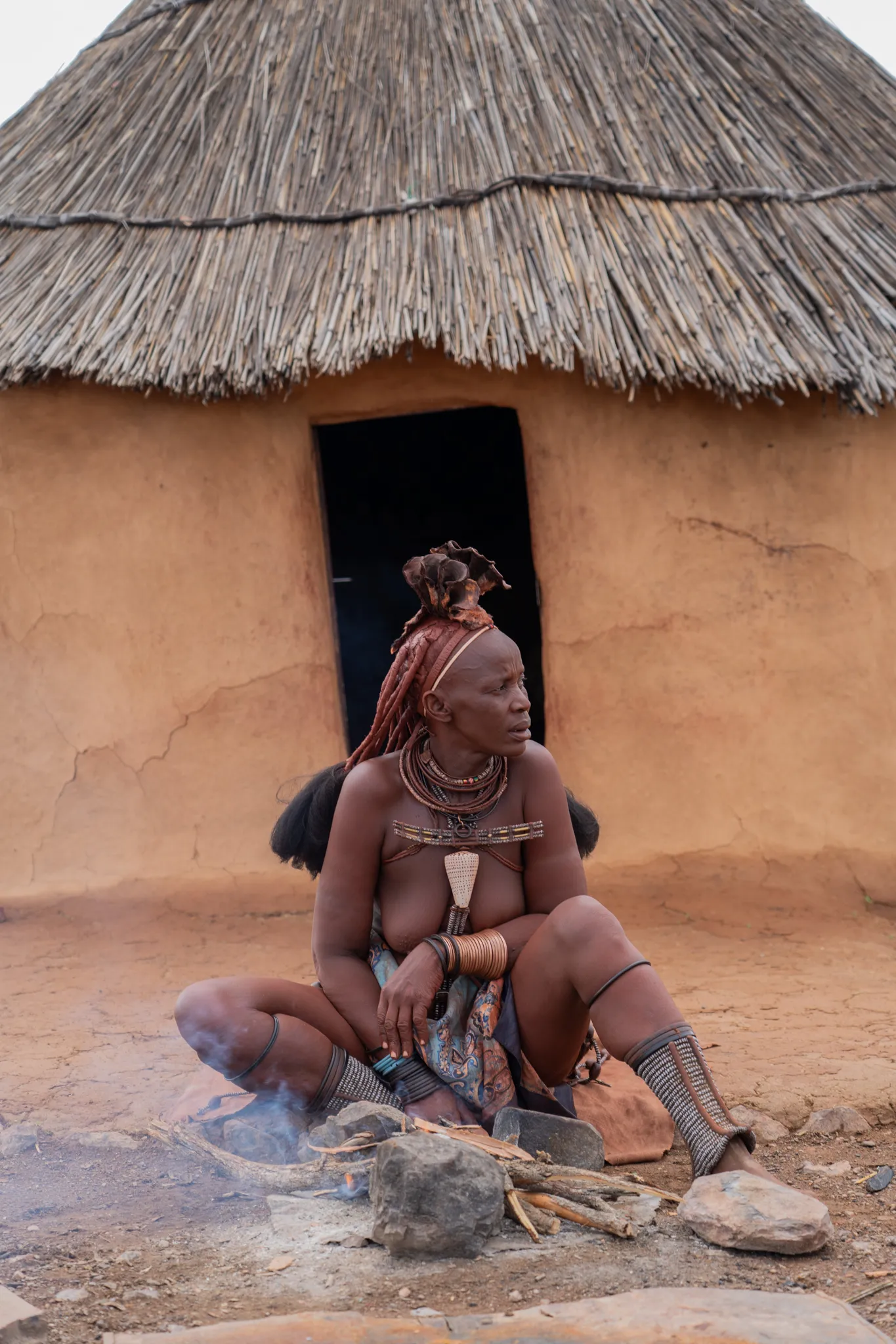 Portrait of a Himba woman by her home, Namibia